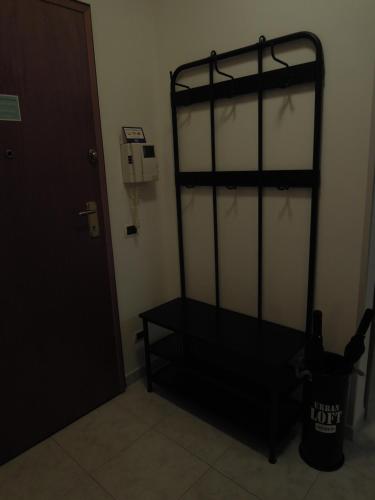 a black bunk bed in a room next to a door at Casa di RO' in Taranto