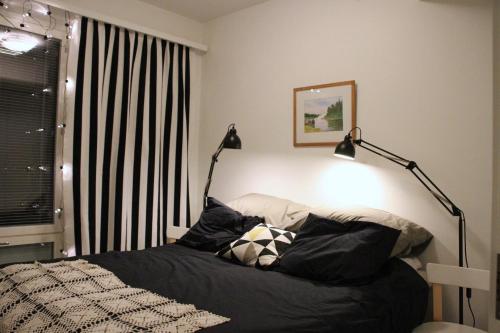 Postel nebo postele na pokoji v ubytování Apartment with Sauna in the heart of Rovaniemi