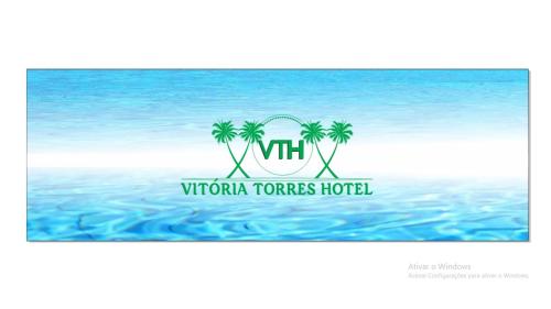 a logo for the virginia towers hotel at Vitória Torres Hotel in Torres