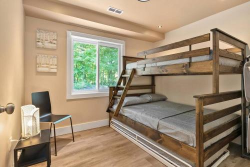 a bedroom with two bunk beds and a desk at Deer Den cottage in Huntsville in Huntsville
