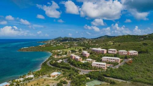 an aerial view of a resort on a hill next to the ocean at St Croix Bliss - Tranquil Retreat-Ocean Views-Island Breezes in Christiansted