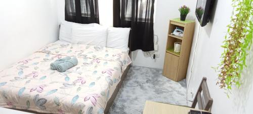 Ένα ή περισσότερα κρεβάτια σε δωμάτιο στο AURORA STAYCATION
