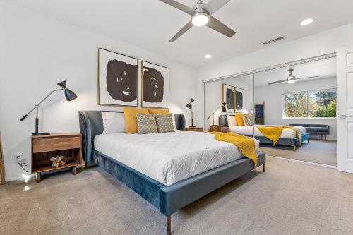a bedroom with a bed and a living room at Trendy 3BR in Sedona: Hot Tub/Fire-pit /Central Location in Sedona