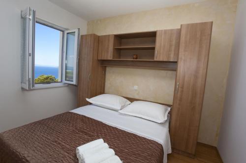 Posteľ alebo postele v izbe v ubytovaní Apartment Marco