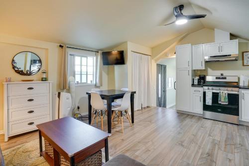 a living room with a table and a kitchen at Avalon Cottage Less Than Half-Mi to Beaches and Crescent Ave in Avalon
