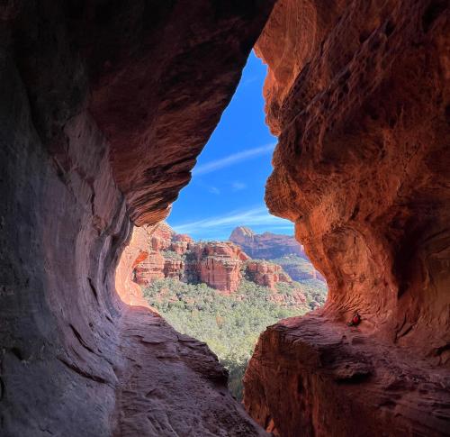 a view from a cave in the canyon at Trendy 3BR in Sedona: Hot Tub/Fire-pit /Central Location in Sedona
