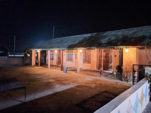 a building with lights on it at night at Rann Kandhi in Dhordo