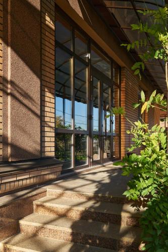 an entrance to a building with glass windows at Podil City View in Kyiv