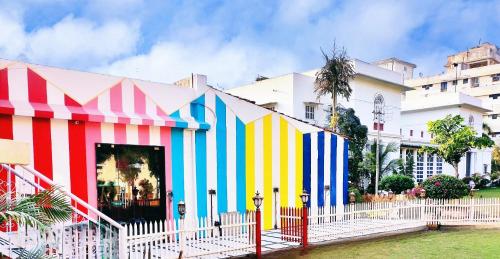 a colorful building in front of a building at The Royal Hermitage - Best Luxury Boutique Hotel Jaipur in Jaipur