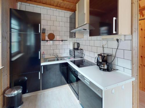 Kuchyň nebo kuchyňský kout v ubytování Ferienhaus Reet am Useriner See
