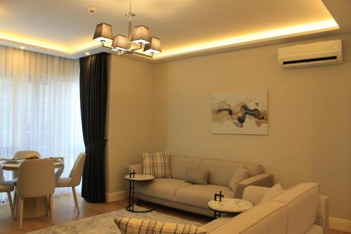 a living room with a couch and a table at Garlon Residence in Istanbul