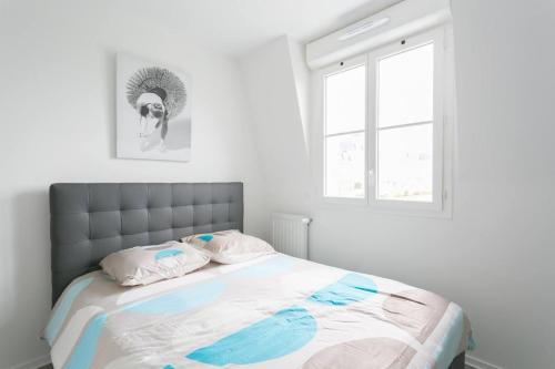 En eller flere senge i et værelse på Big House 2 minutes from Disneyland Paris