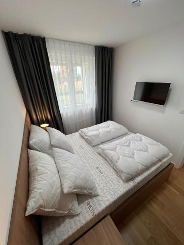 Postel nebo postele na pokoji v ubytování Apartman Zarić Jahorina - Snježna Dolina Resort