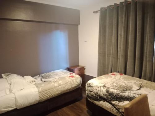 Voodi või voodid majutusasutuse Hotel Terrasol Iquique toas