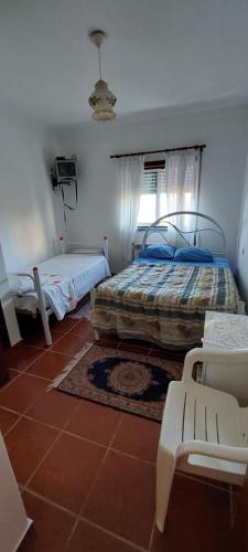 Postel nebo postele na pokoji v ubytování Alojamento da Avó Maria