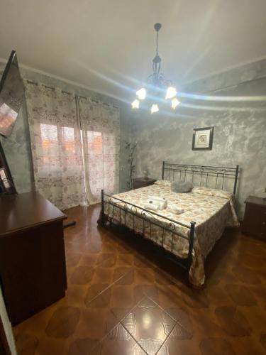 A bed or beds in a room at Alloggio Micheli