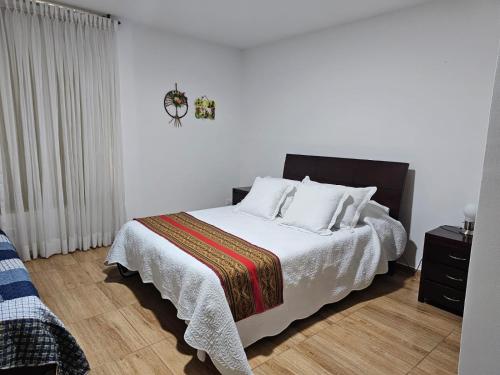 Cama o camas de una habitación en ALOJAMIENTO Familiar HECTRIGA