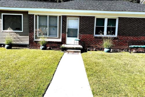 a house with a walkway in front of a yard at Home Sweet Home in Columbia