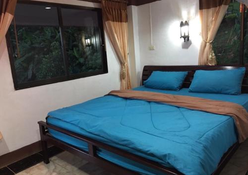 Postel nebo postele na pokoji v ubytování Ban Rabiengfah Resort