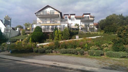 a large house on top of a hill with a garden at Humboldtruh in Weitersburg