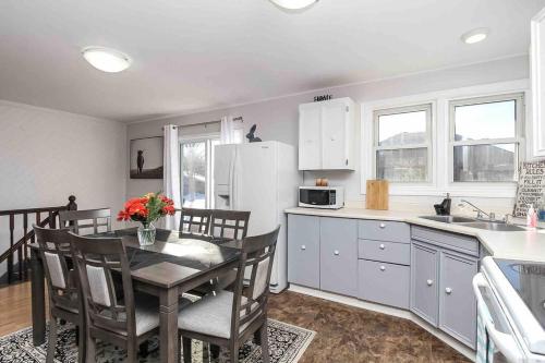 a kitchen with a table and chairs and a refrigerator at Farm House in Coldwater