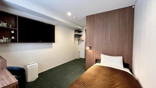Postel nebo postele na pokoji v ubytování Belmont Hotel