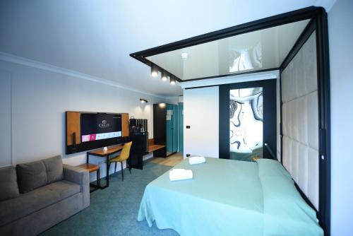 Postel nebo postele na pokoji v ubytování Hotel Celis