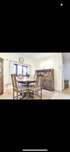 a dining room with a table and two chairs at Dorterry House in Ilkeston