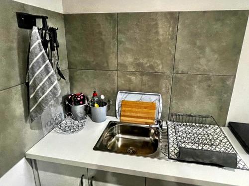 a kitchen with a sink and a counter top at Starlight Stay in Groblersdal