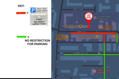 a screenshot of a cell phone with a no notification for parking at Harmony home Lindley Huddersfield in Lindley