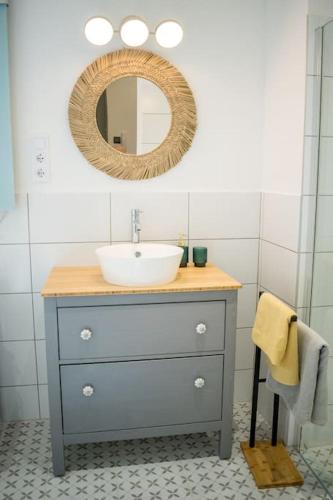 a bathroom with a sink and a mirror at Downtown apartment 2 minutes from Opera House in Budapest