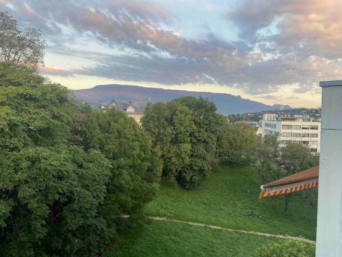 an overhead view of a field with trees and buildings at Studio de 28 m2 lumineux et élégant in Chambéry