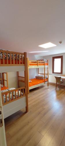 a room with three bunk beds and a table at SAMATYA APARTı in Istanbul