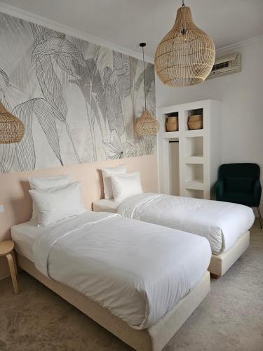 Postel nebo postele na pokoji v ubytování Riad Coconut