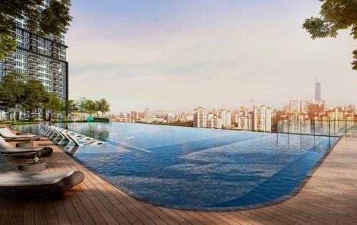 a large swimming pool on the roof of a building at M Vertica kl 3r2b 7 pax cosy house 3min mrt, sunway velocity mall, 8min ikea in Kuala Lumpur