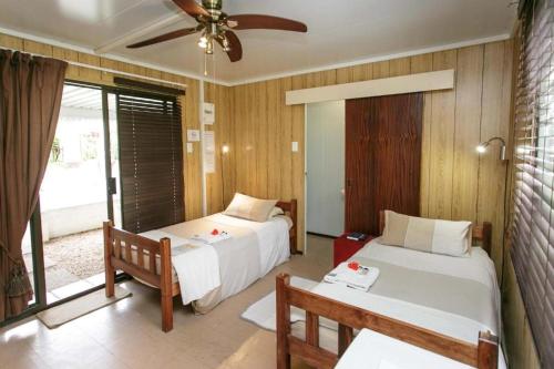 Ένα ή περισσότερα κρεβάτια σε δωμάτιο στο Sunbell Ventures Guesthouse