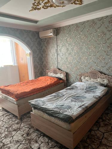 Een bed of bedden in een kamer bij Welcome TJ Apartment