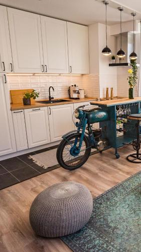 a kitchen with a bike sitting on the floor at Stylish Oasis Central Apartment with AC and Parking in Budapest