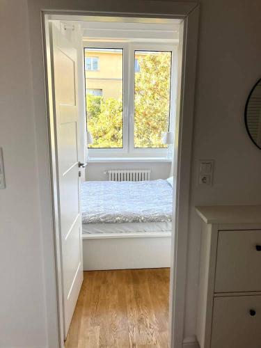 a room with an open door with a window at Cute Apartment In The City Center , 2-Beds , Wi-Fi - by HIK Apartments in Warsaw