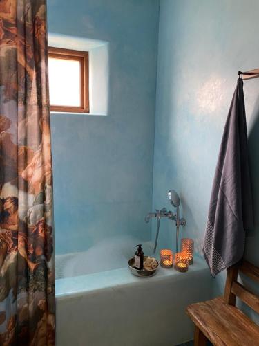 a bathroom with a bath tub with a shower curtain at Vaxholm Apartment in Vaxholm