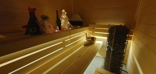 a room with stairs with lights and christmas decorations at Dom z sauną i widokiem na jezioro in Pluski