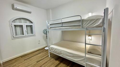 Postel nebo postele na pokoji v ubytování Bright Homestay - New Cairo