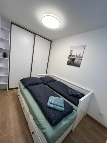 A bed or beds in a room at Borovicový Háj Apartment Košice