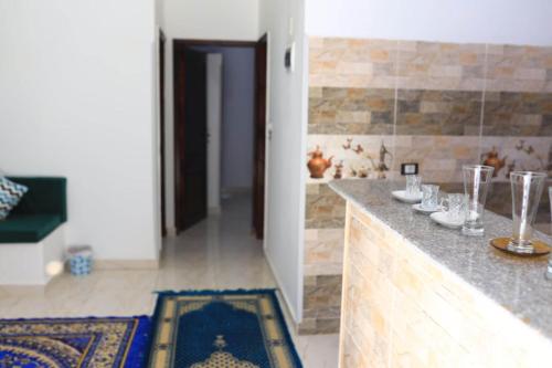 a kitchen with a counter with glasses on it at Magic Place Luxor in Luxor