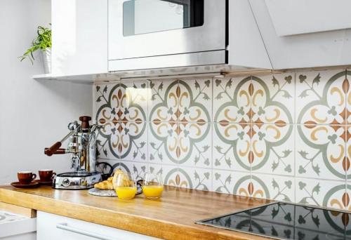 a kitchen with a counter with two oranges on it at Penthouse in Oslo's hippest district Grünerløkka in Oslo