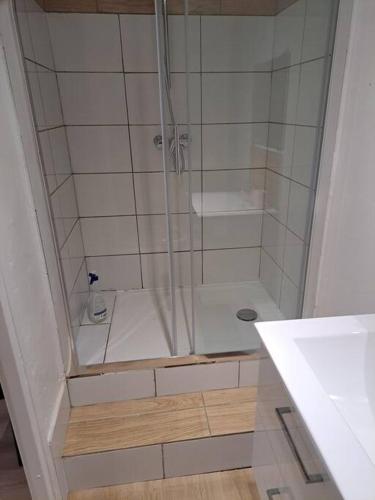 a shower with a glass door in a bathroom at 195, studette porte d'Italie rue populaire. in Toulon