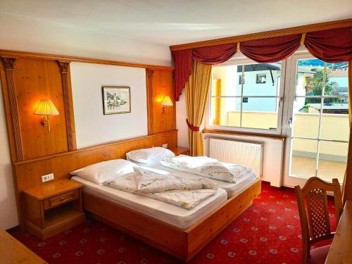Postel nebo postele na pokoji v ubytování Hotel Tanja-Sonnenhof