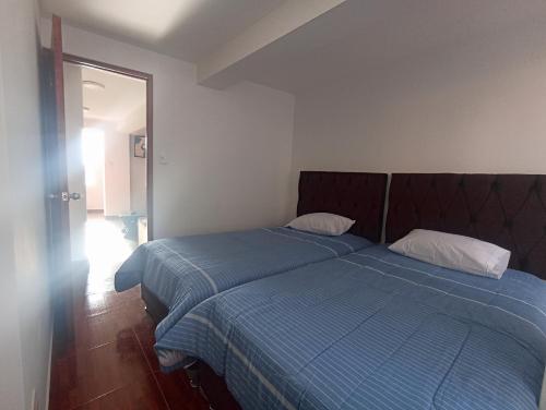 Un pat sau paturi într-o cameră la La Posada del Monge