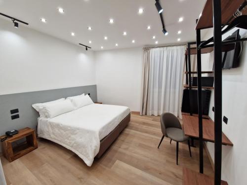 Säng eller sängar i ett rum på Hotel La Superba
