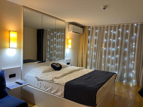Postel nebo postele na pokoji v ubytování Orbi City apartment 40 этаж